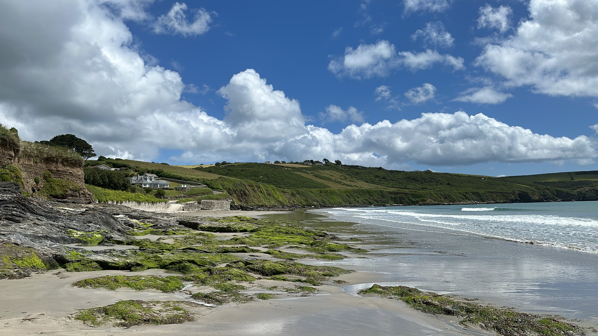 Sunny Cornish beach with cliffs